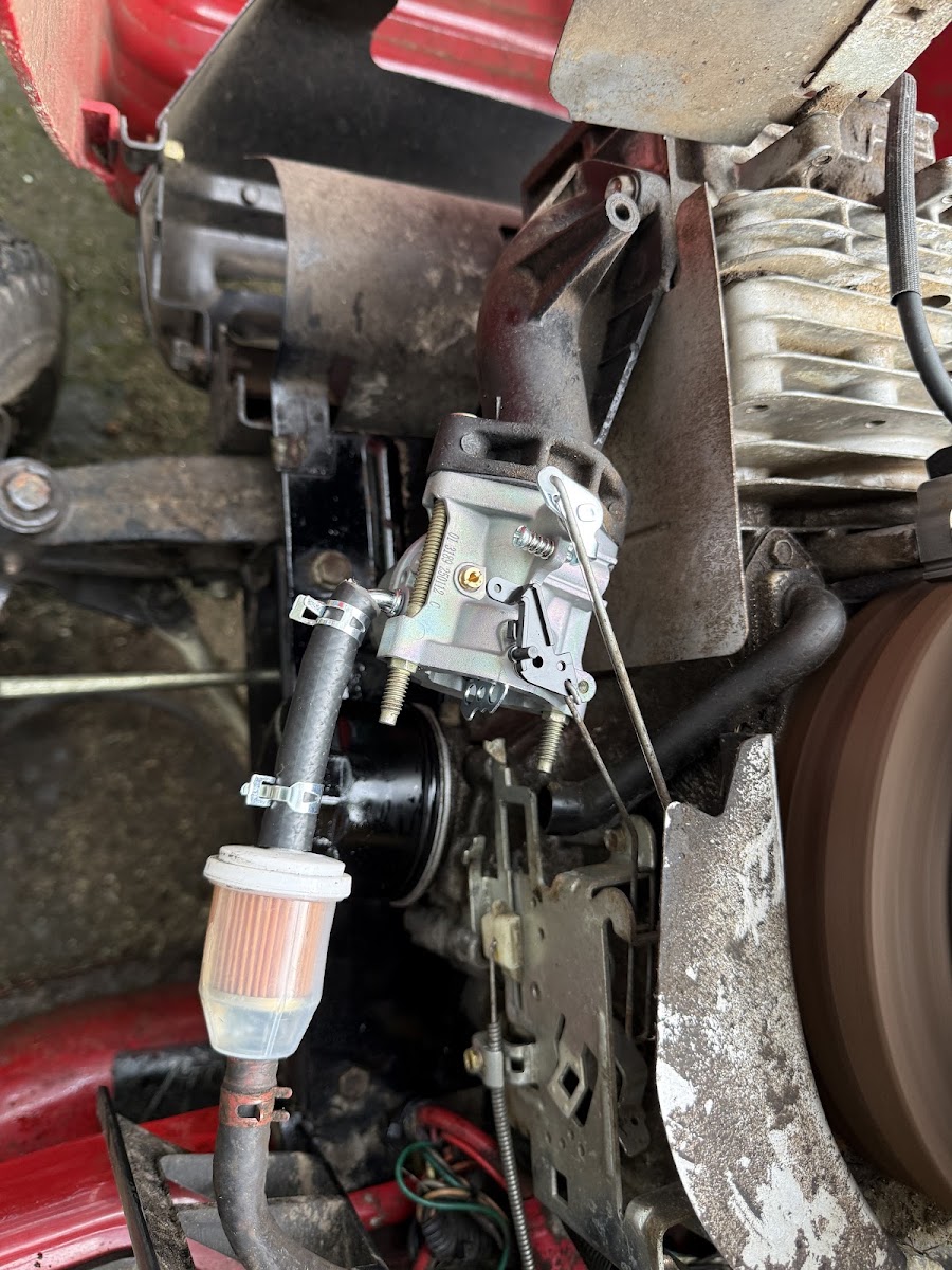 Engine carburetor being serviced