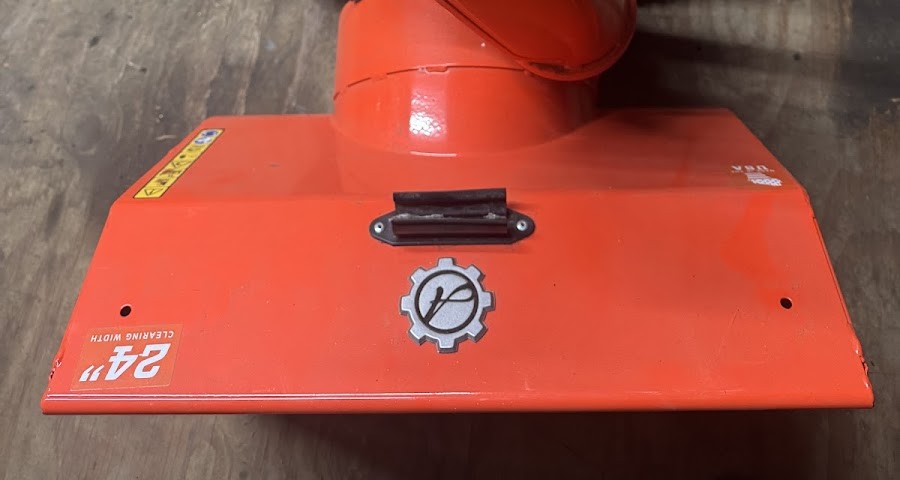 Snowblower auger housing being serviced